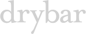 The image shows the word "drybar" in all lowercase, gray, serif font against a white background.