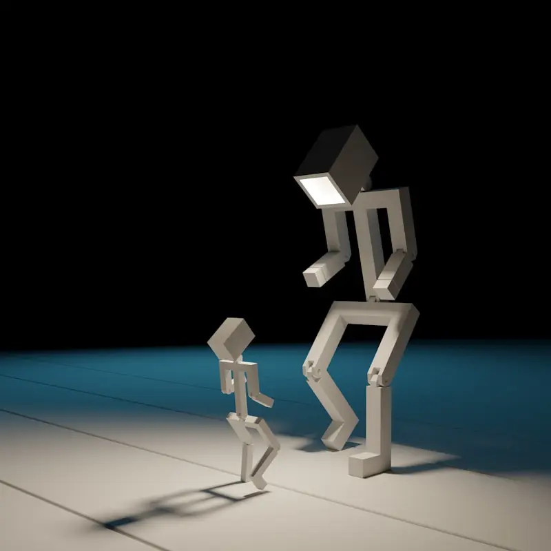 Two geometric, human-like figures with rectangular heads, one large and one small, stand facing each other in a dimly lit room with a spotlight effect.